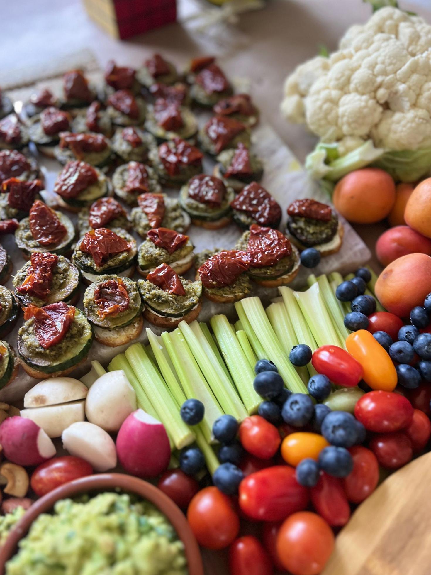 Vibrant vegan catering spread with fresh vegetables and plant-based appetizers
