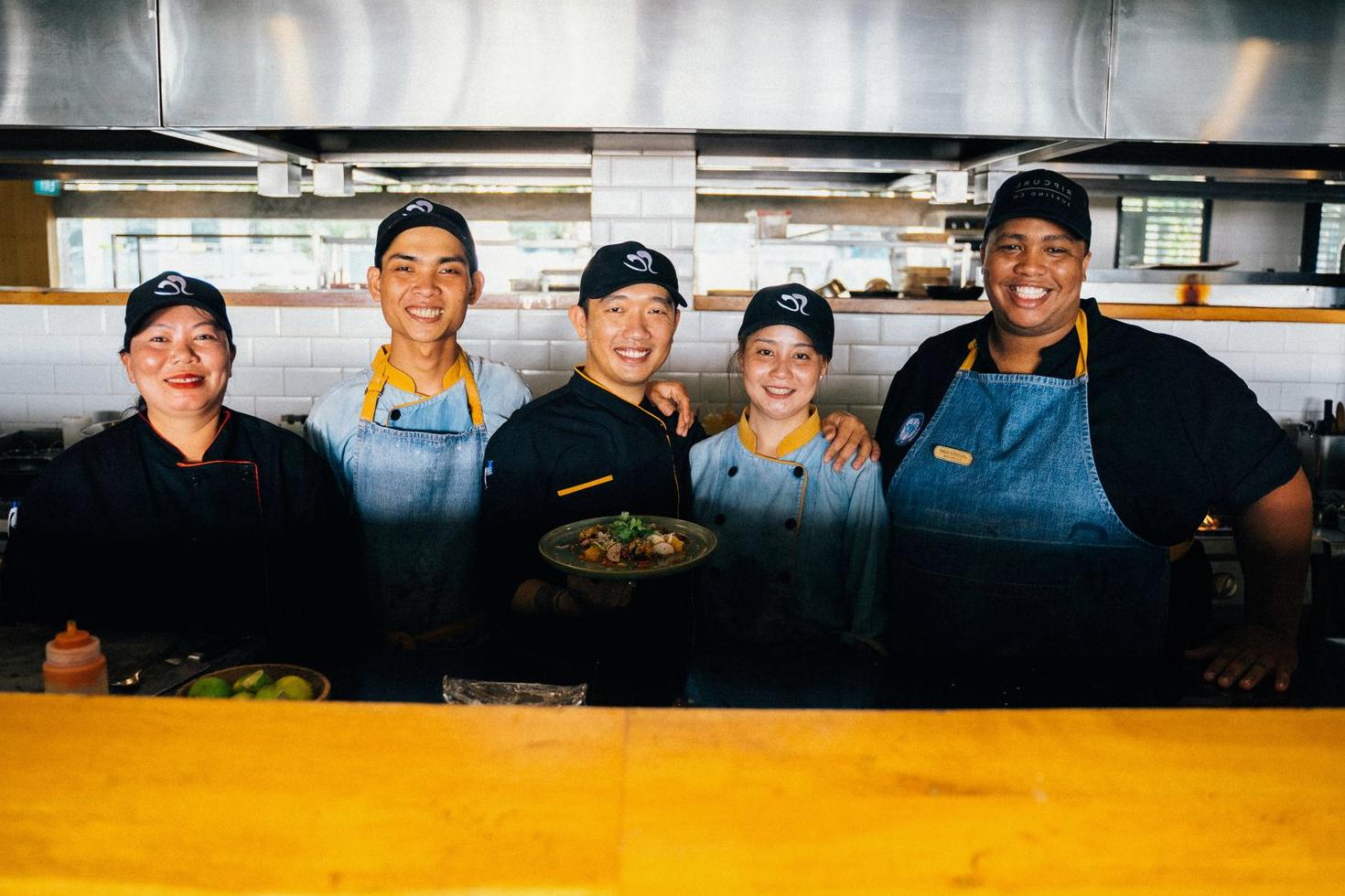 Actionofferline culinary team preparing fresh vegan dishes